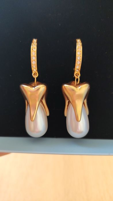 Серьги Schiaparelli.