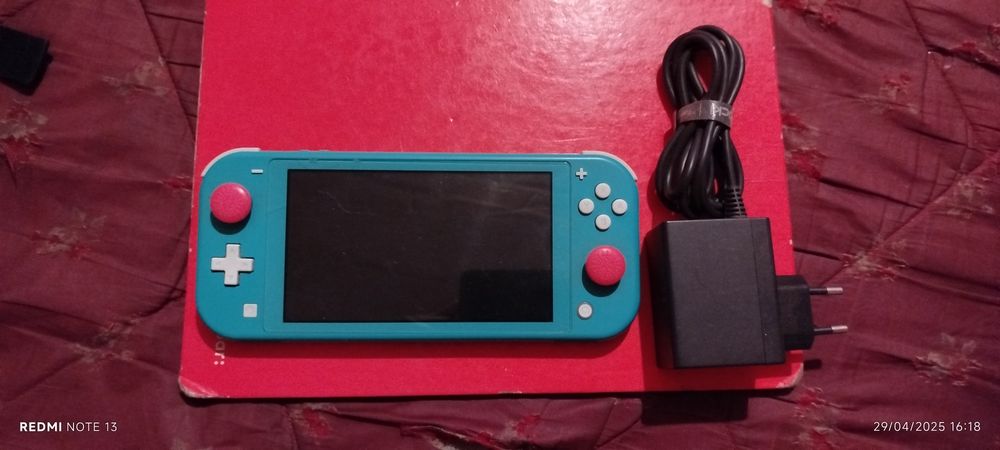 Vendo Nintendo Switch Lite azul bebé + bolsa de transporte.
