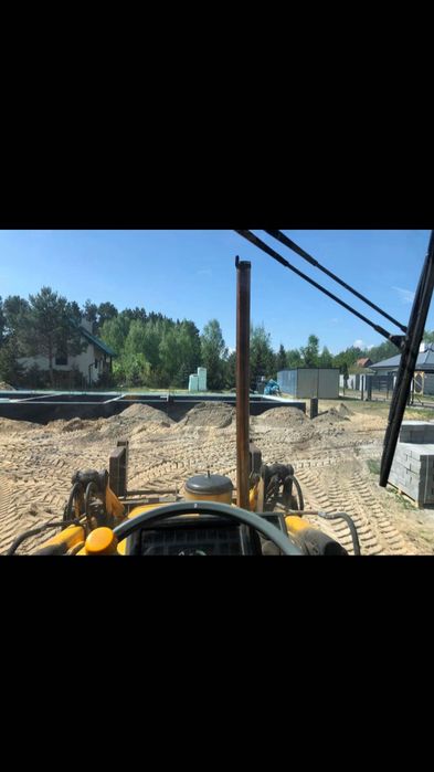 Usługi koparko-ładowarką,koparką kołową,ziemia,piach,wyburzenia