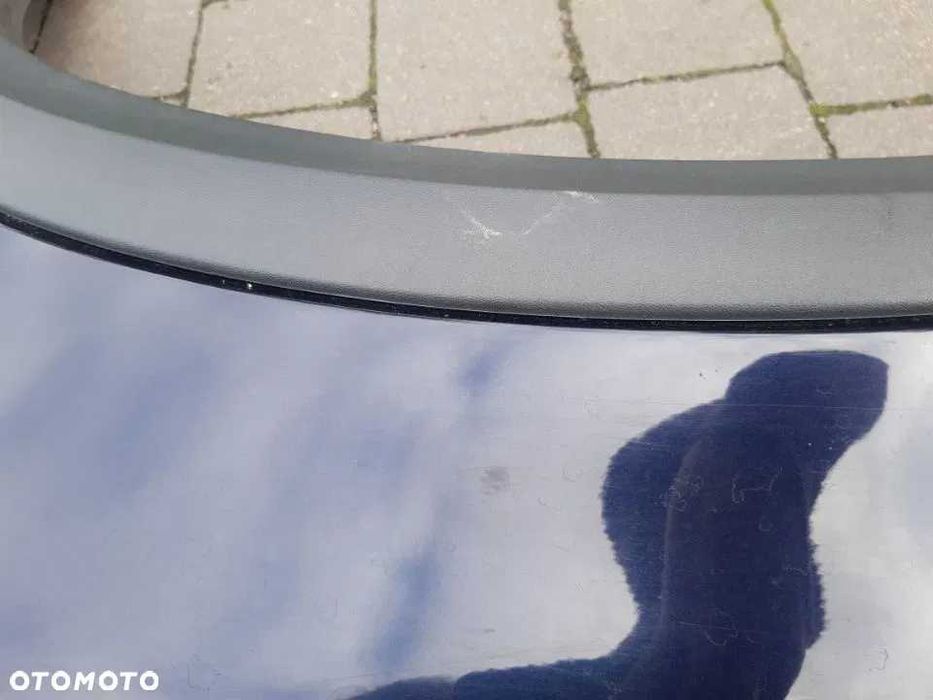 Volvo XC90 XC 90 błotnik lewy przód przedni z listwą granatowy