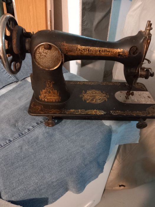 Máquina de costura (cabeça)