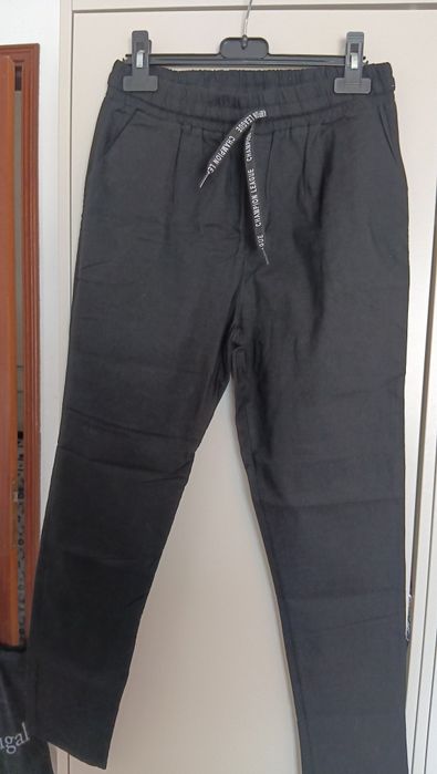 Calças novas, preço unitário