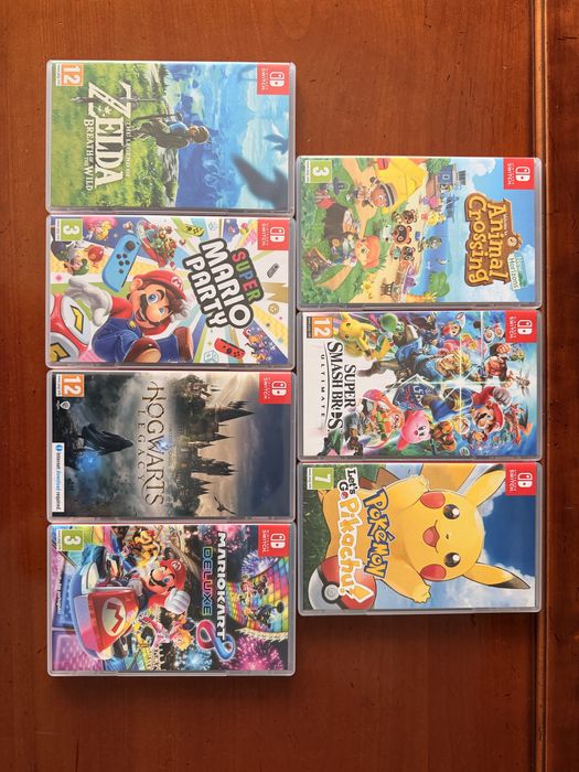 Nintendo Switch V2 (Caixa e Acessórios) + Mala + 7 Jogos