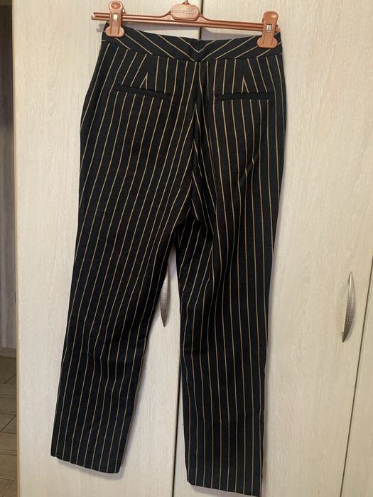Брюки в смужку розмір 36