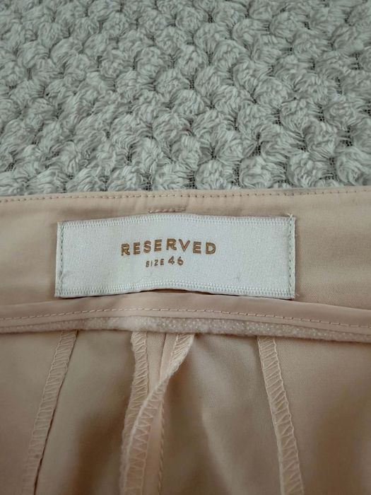 Eleganckie spodnie Reserved rozmiar 42/44.