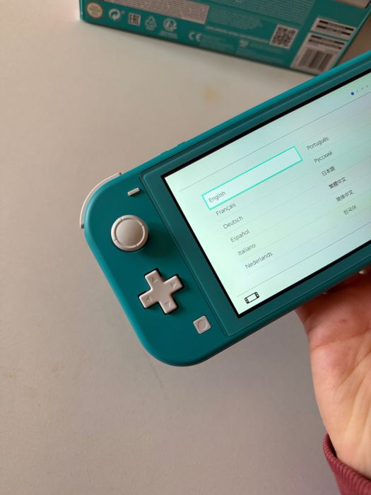 Nintendo Switch Lite c/película de vidro + capas