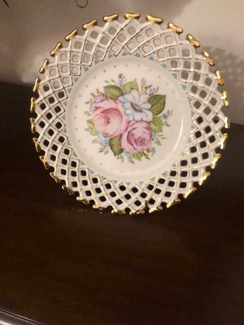 Hand-painted porcelain plate with a beautiful lace-like rim