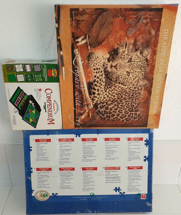 Puzzles novos selados e jogos de tabuleiro damas solitário