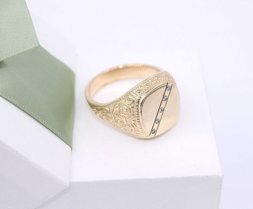 Złoty sygnet p.585/15,38g z brylantami