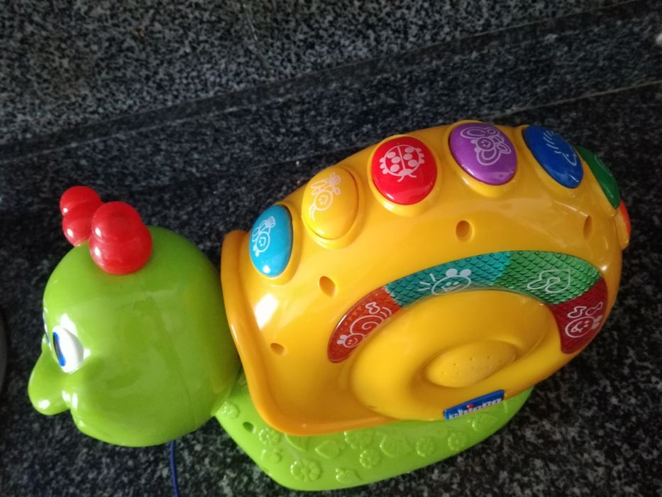 Brinquedo Chico (caracol musical com rodas)