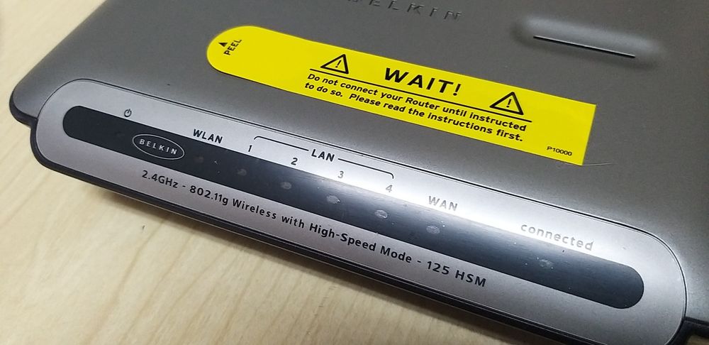 Router Belkin, com manual de instruções.