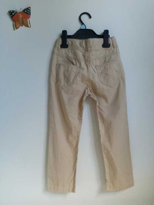 Długie spodnie beżowe lekkie przewiewne wiosenne letnie Next 122 7 lat