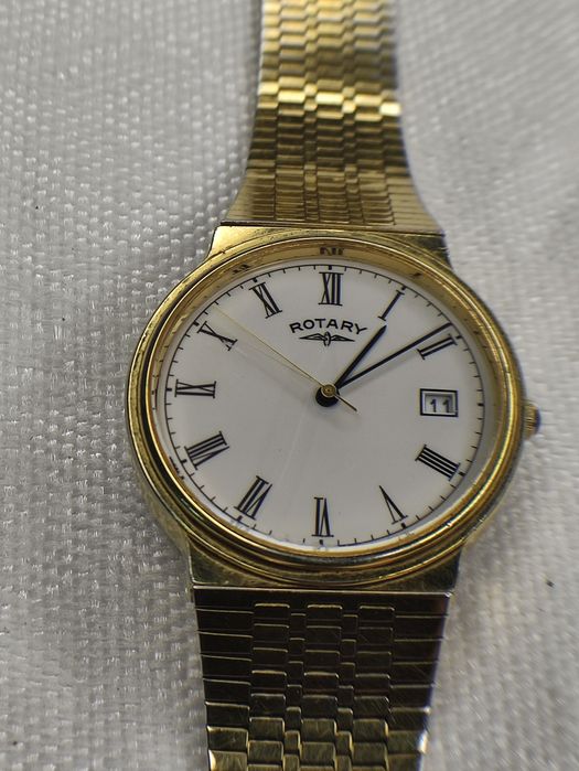 Rotary годинник наручний .позолота.