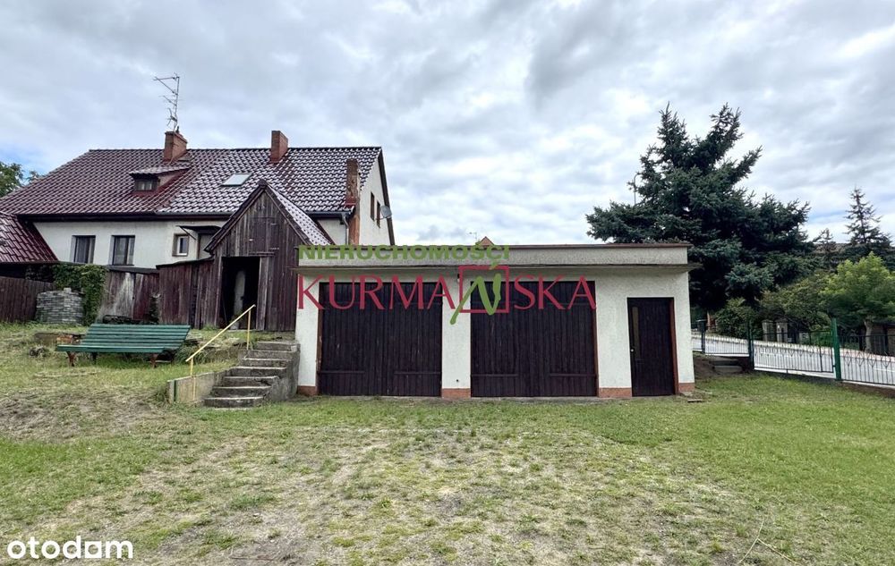 Dom bliźniak z budynkiem stacji diagnostyki samoch