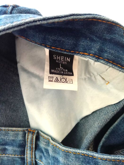 Новые джинсы с дырками