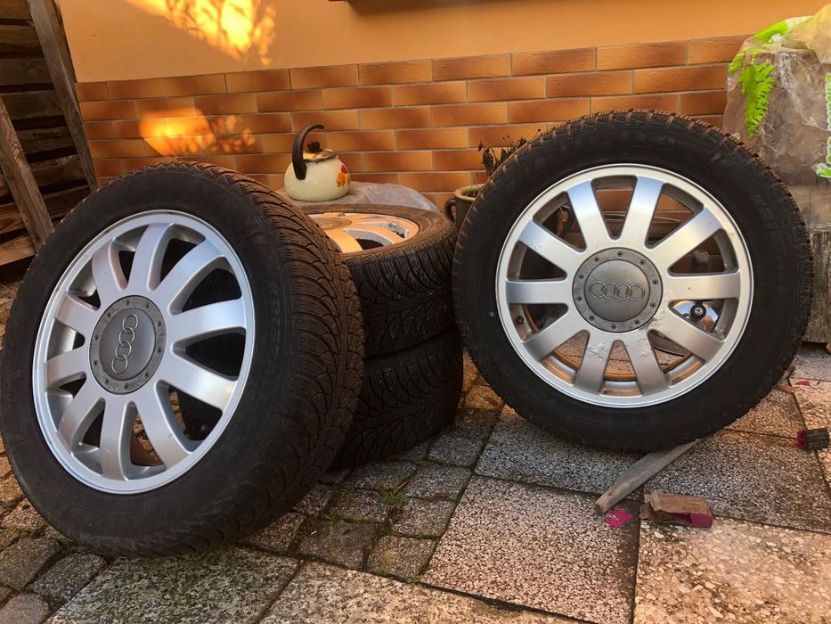 Opony z felgami aluminiowymi 16 cali z dekielkami Audi