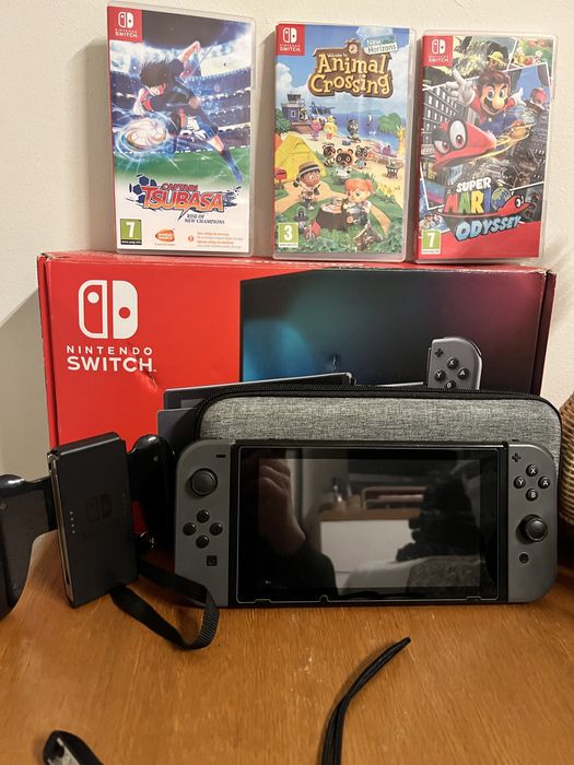 Nintendo Switch com Mario odyssey e Animal Crossing