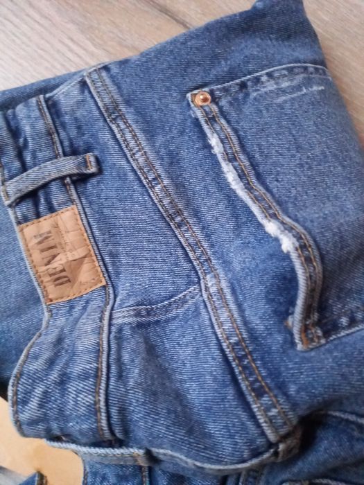 ASpodnie jeans Denim Sinsay roz 42 XL z rozdarciami