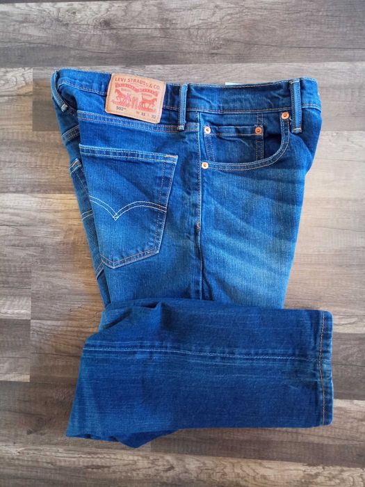 świetne spodnie Levi"s 502 31/32 w super stanie