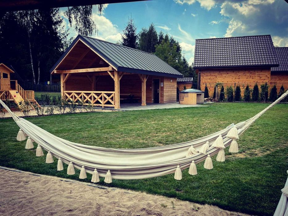 Domek z jacuzzi i sauną nad jeziorem Okuninka | J.Białe