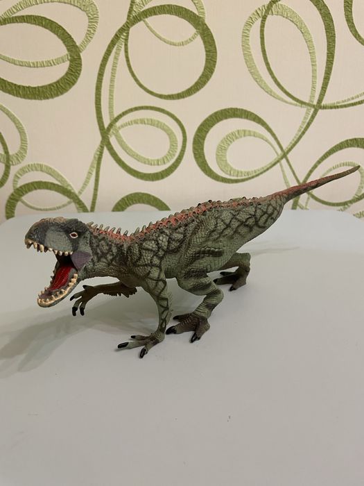 Динозавр іграшка