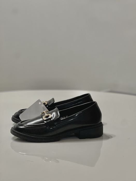 Нові туфлі лофери