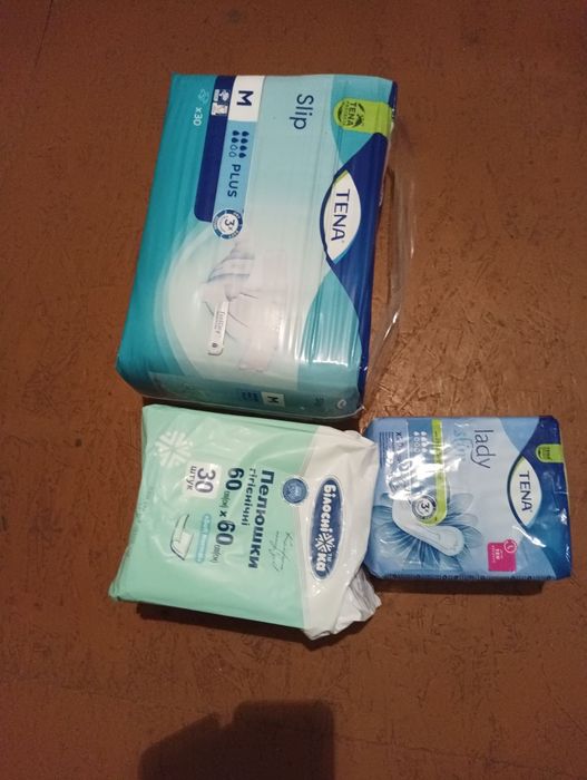 Підгузники, урологічні прокладки, пелюстки Tena, Білосніжка