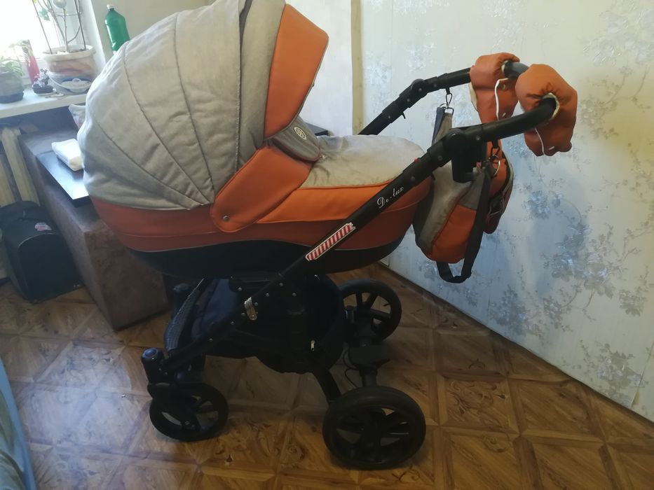 Продам ТЕРМІНОВО Коляску 2 в 1 De Luxe (Еко шкіра + текстиль )