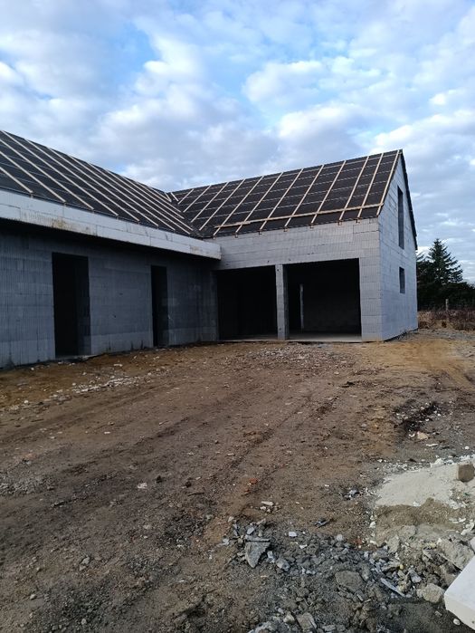 Prace ziemne koparko ładowarką Budowa Domów ICF  IZODOM