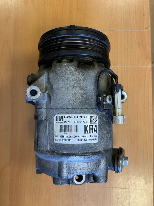 Компресор кондиціонера  Опель Астра Н