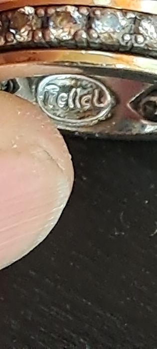 Anel rotativo em Ouro e Prata.