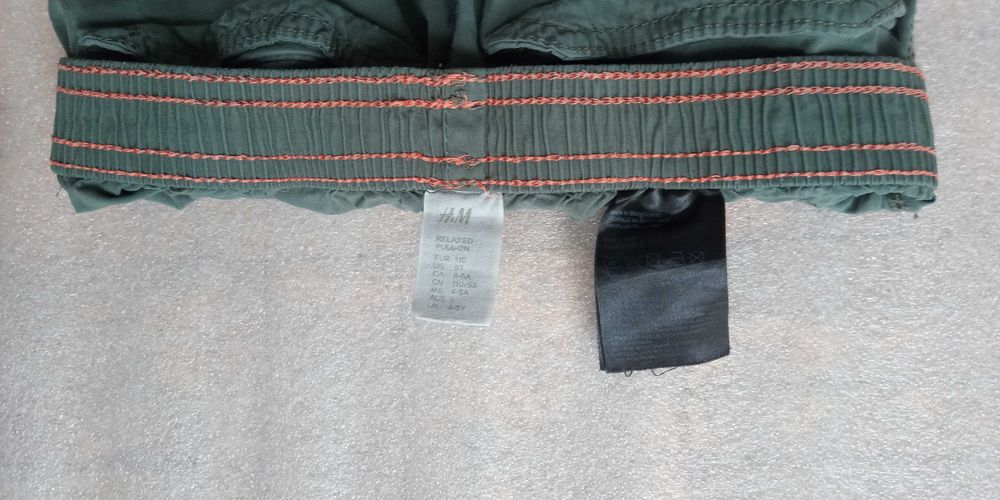 Spodnie H&M  przeciwdeszczowe rainwear chłopięce zielone rozmiar 110cm