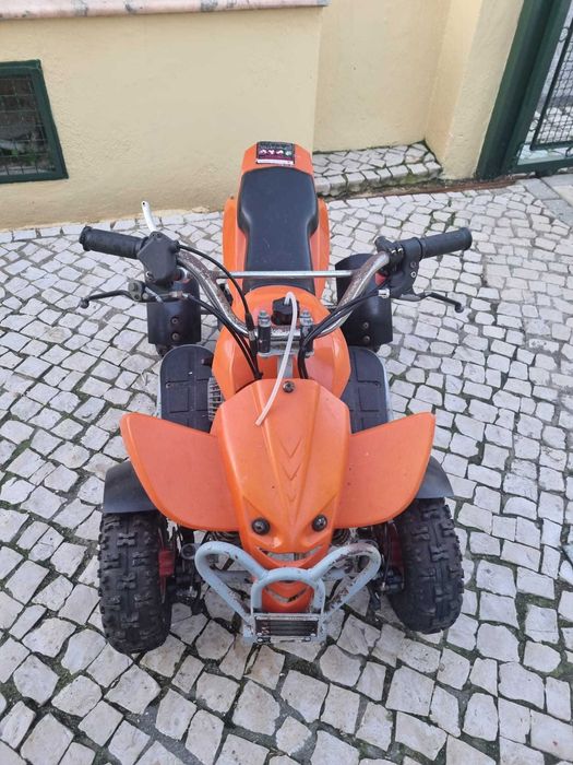 Moto 4 de criança a gasolina