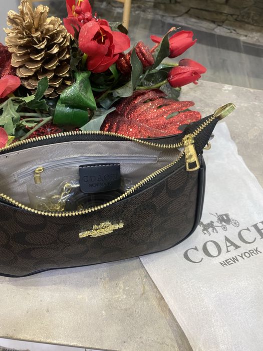 Mala senhora  coach nova muito elegante e muito bom acabamento