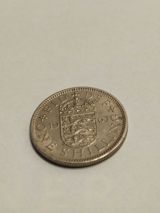 Sprzedam monetę Wielka Brytania 1 szyling 1963r. Elżbieta II stan db.