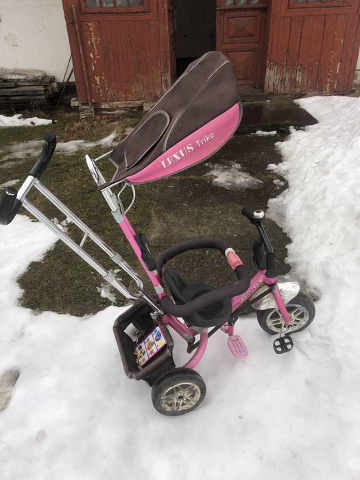 Дитячий велосипед з батьківською ручкою.