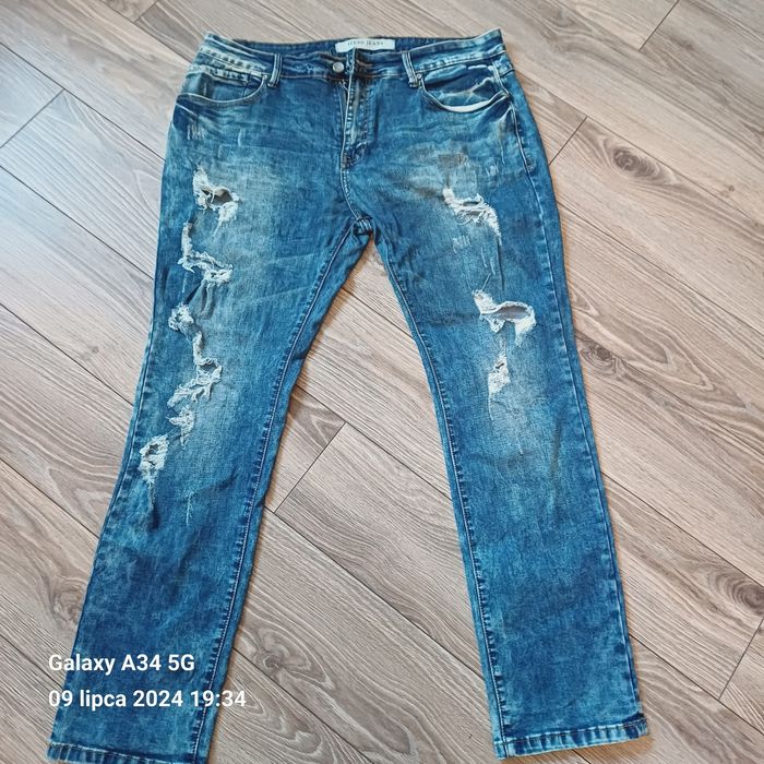 Spodnie jeansowe damskie z dziurami XL