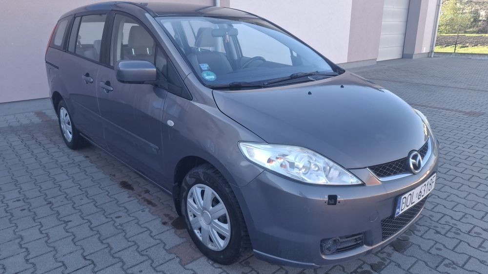 Mazda 5 2007 r. | 1.8 Benzyna (115 KM) | Przebieg 261 tys. km | Grafitowy Metalik | 7 Miejsc