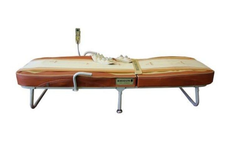 Масажне ліжко для лікування та витяжки спини