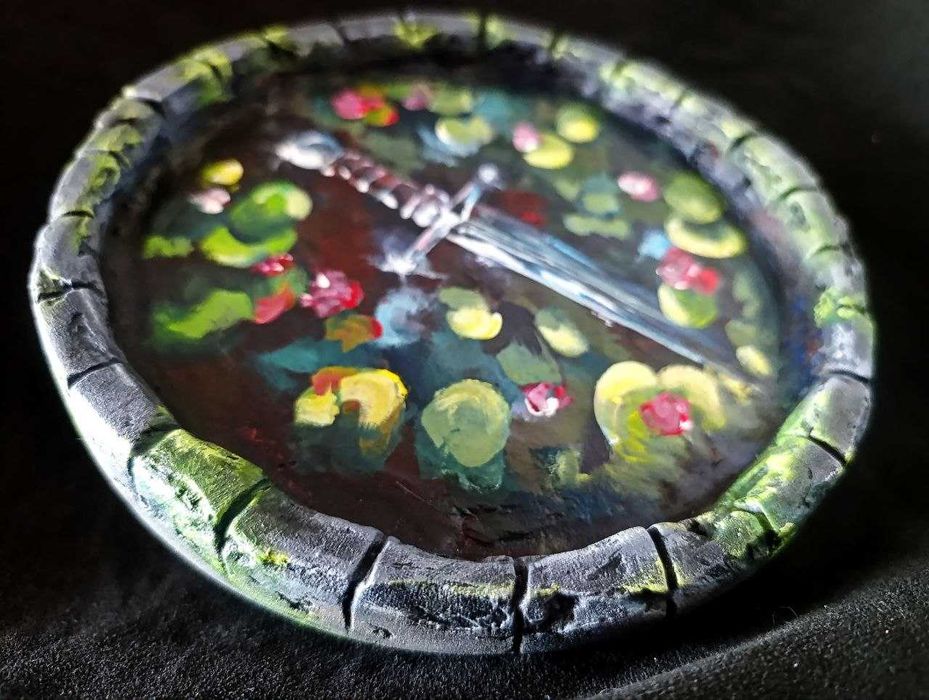 Pintura de uma espada num poço D20 cm