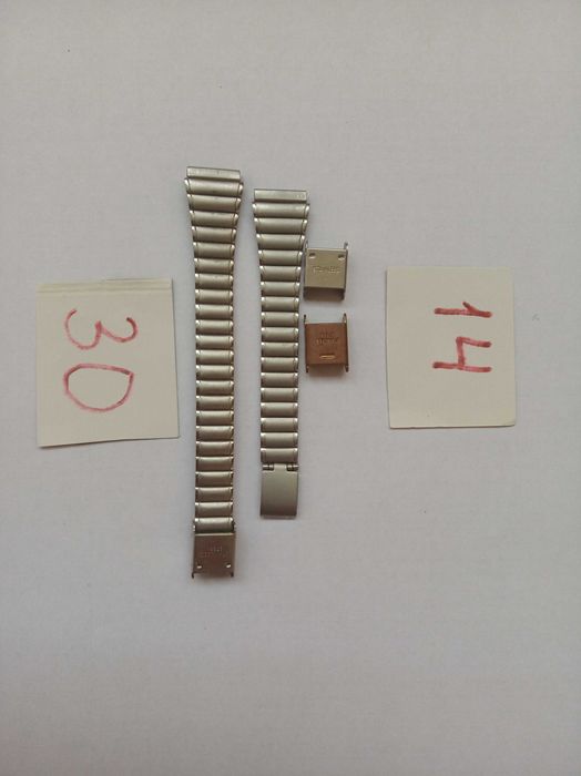 Металеві браслети до годинників