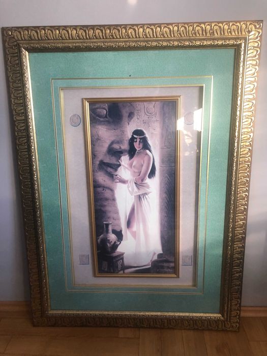 Obraz w złotej ramie .