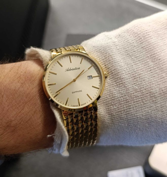Piękny szwajcarski zegarek męski Adriatica w k. złotym, szafir, nowy