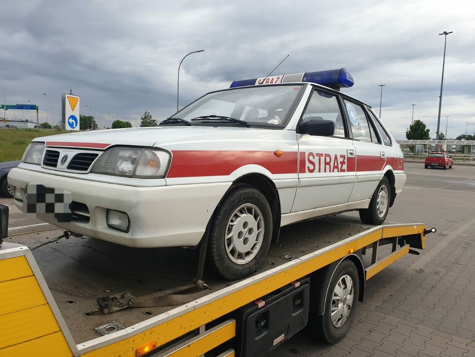 TANIO laweta pomoc drogowa holownik transport aut  24h