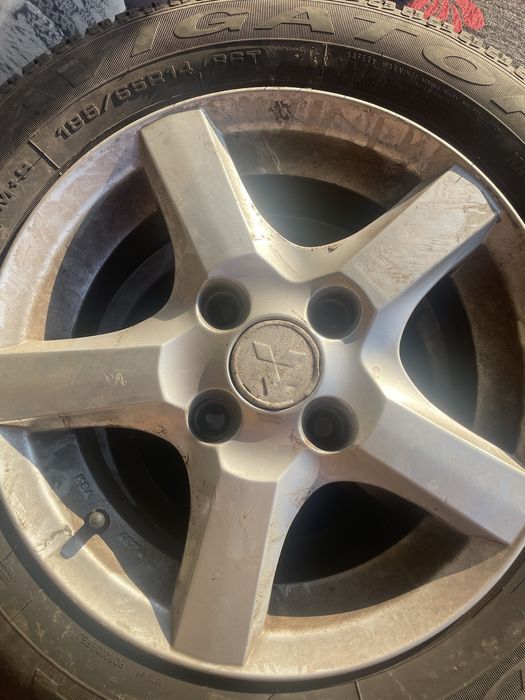 Opony wielosezonowe Dębica Navigator 2 + alufelgi Mitsubishi 14 cali
