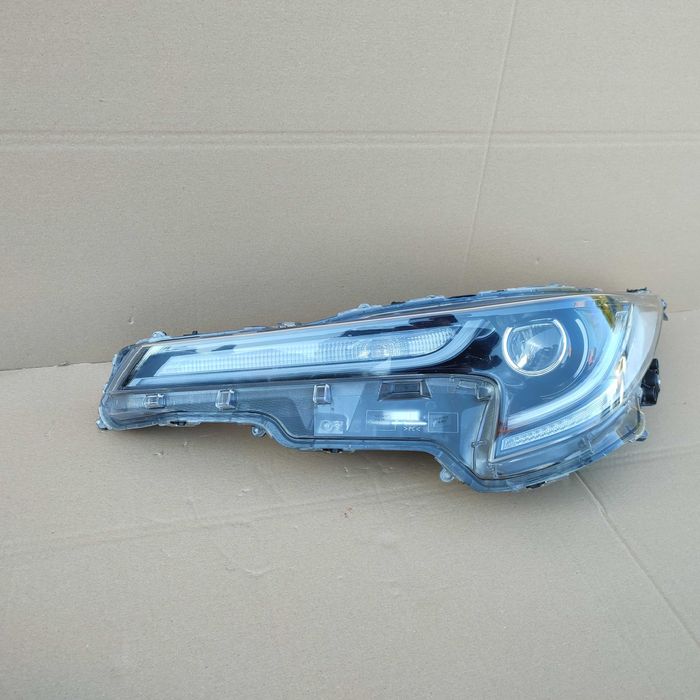 Toyota Corolla XII E21 kombi HB lampa lewa reflektor oryginał EU