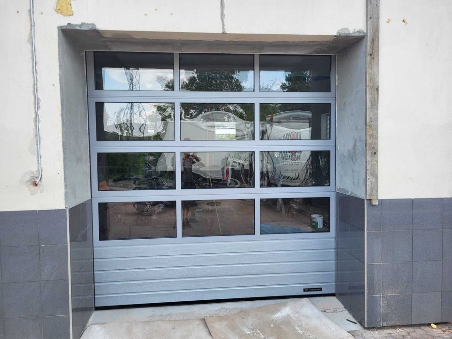 Naprawa uszkodzonej zerwanej pękniętej sprężyny linki bramy garażowej