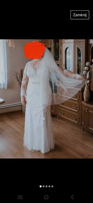 Długa przezroczysta suknia ślubna bez trenu z welonem