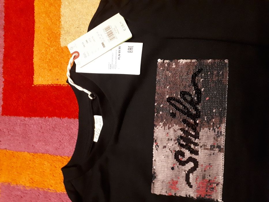 Czarna bluzka długi rękaw cekiny 128 134 nowa