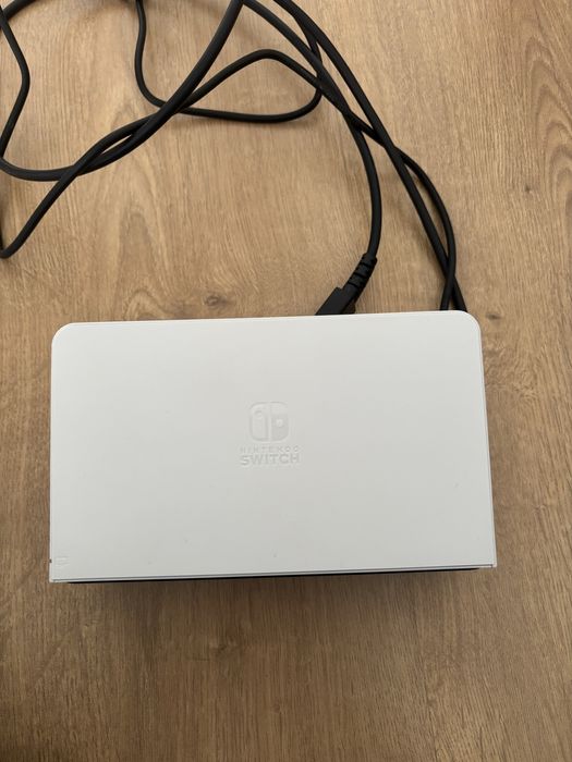 Nintendo switch oled + bolsa de transporte + jogo